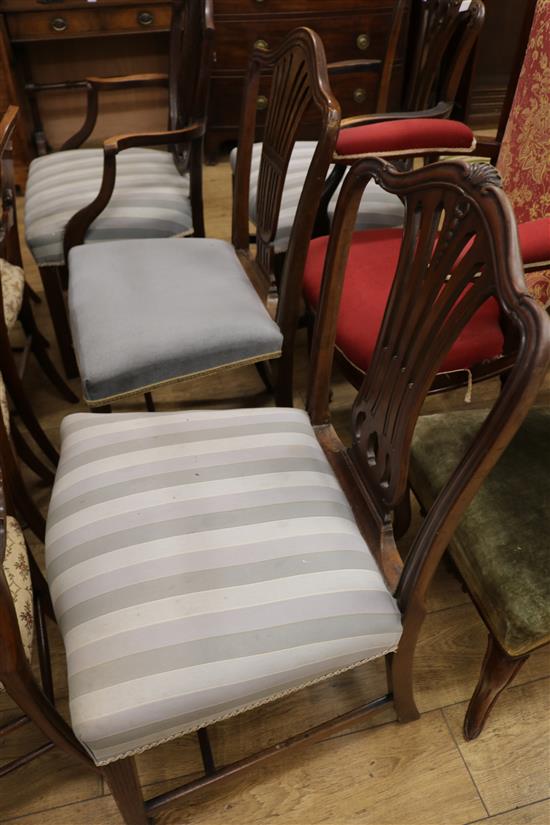 Four Hepplewhite style mahogany dining chairs (two arm, two single)